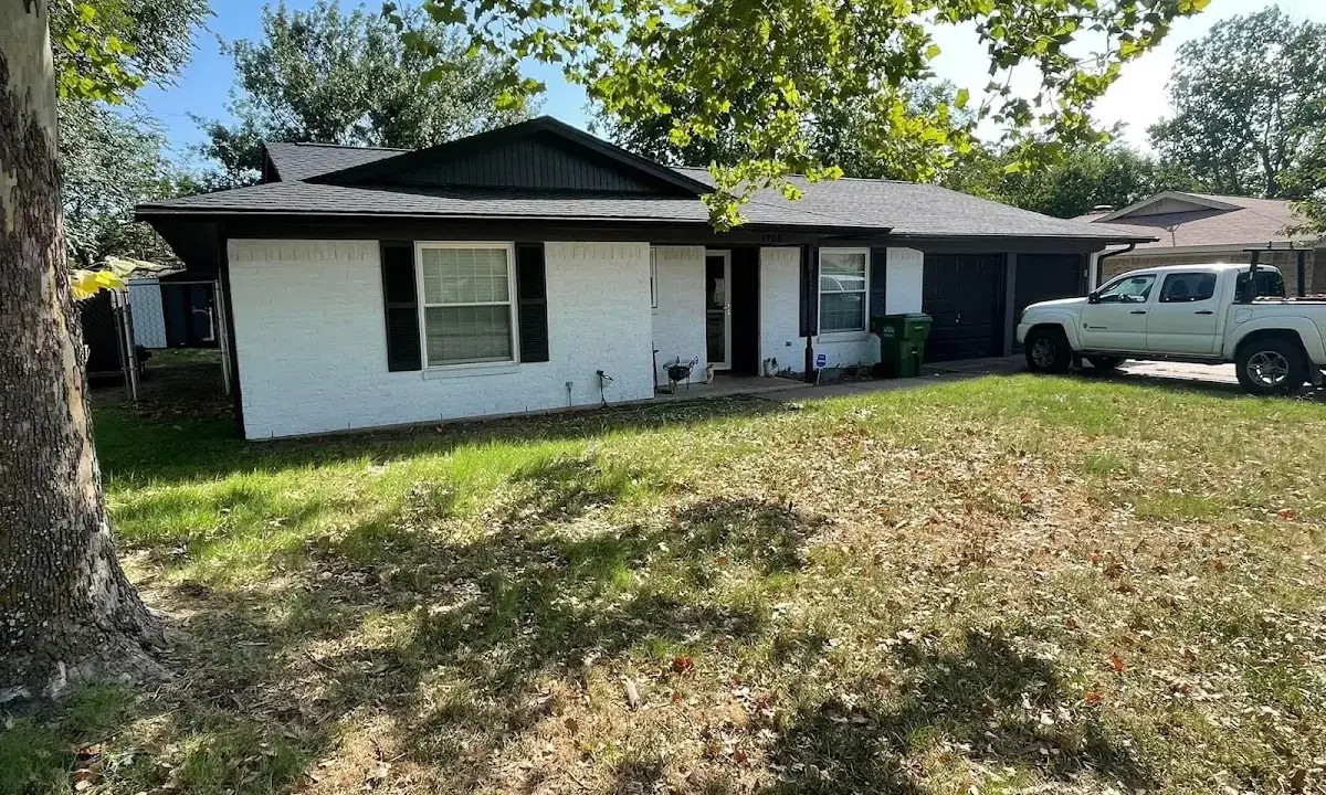 Professional roofing crew working on a residential roof in Jessup